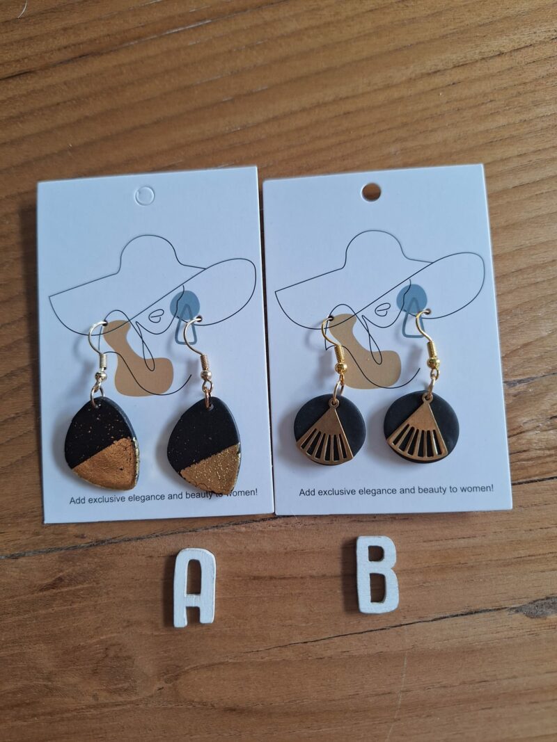 Variatie zwart/goudens hangers